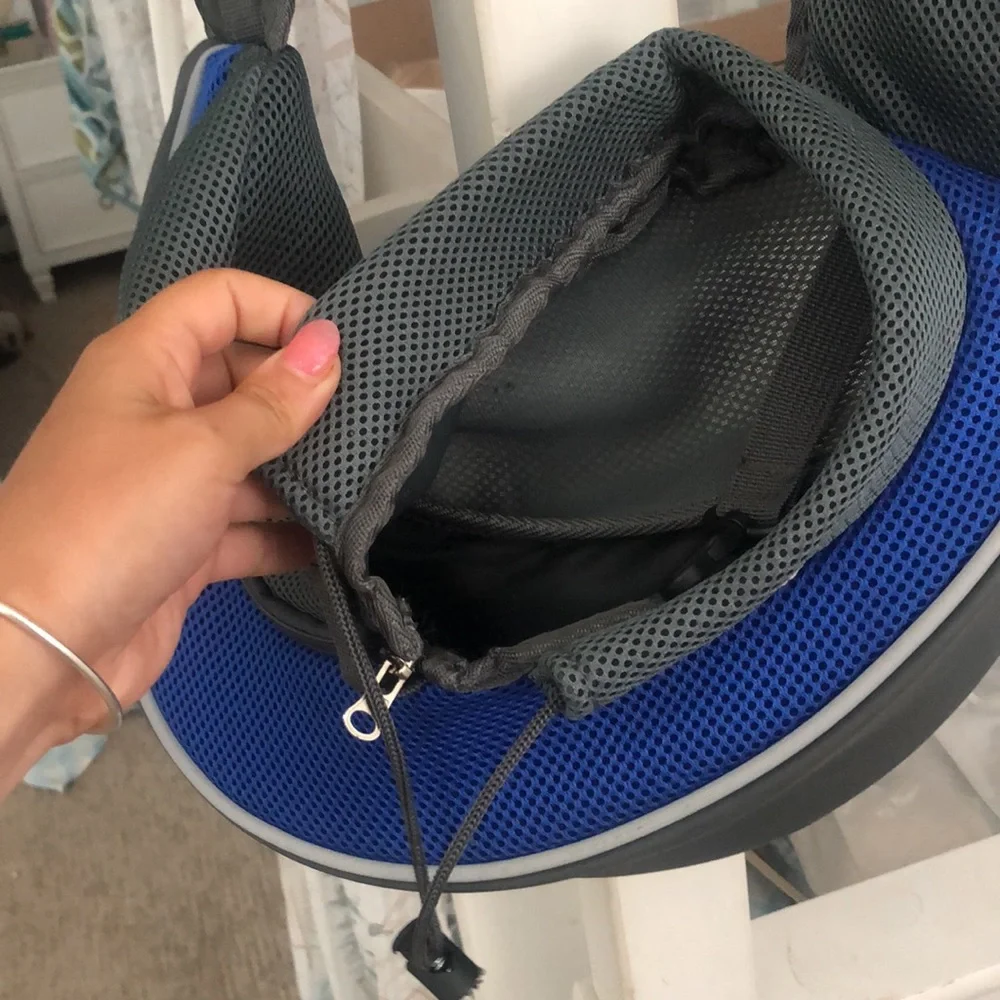 Puppy holder for small dogs. Adjustable straps very convenient